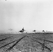 British tanks moving forwards through gaps in Axis minefields, cleared by Allied engineers and infantry, to engage German and Italian armour El Alamein 1942 - British tanks.jpg