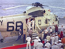 The Apollo 8 crew disembarks Helicopter 66 aboard USS Yorktown following their return to Earth in 1968 Helicopter 66 Apollo 8.jpg