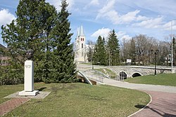 Bridges over Vigala River. Rapla church in the background and monument to Brigadier General Märt Tiru on right.