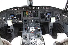 The cockpit of a CRJ100LR OD-TAL Canadair CRJ.100LR Flight Deck (7608261422).jpg