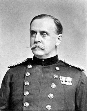 Black and white photograph of a man wiht a moustache in uniform.