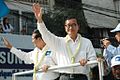 CNRP President Sam Rainsy and Vice President Kem Sokha wave to protesters during a demonstration in December 2013.