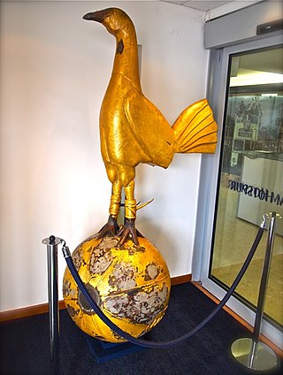 The original bronze figure of the Spurs cockerel on a ball on display in the lobby at White Hart Lane