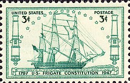 A postage stamp accurately depicts Constitution at sail. The ship sails to the right side of the stamp.