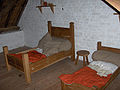 Children's bedroom with large pillows and the blankets coloured with madder