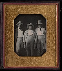 A photo of three unknown men representing the Southern planter class that promoted slavery, expanded westward, and decried federal attempts to control slavery's expansion or to implement taxes. -Three Planters- MET DP338158.jpg