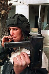 Chechen irregular fighter with a Borz submachine gun Evstafiev-chechnya-tank-helmet.jpg