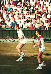 McEnroe with Fleming playing as a doubles team at Wimbledon in the 1980s. Fleming & McEnroe Wimbledon 1980s.jpg