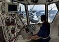 View of an SH-60B Seahawk helicopter aboard USS James E. Williams' flight deck, seen from inside the ship's flight control tower on 3 May 2012