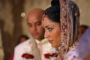 English: A Hindu bride during traditional wedd...