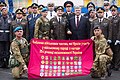 President Poroshenko and the commanders of all parade contingents in front of a banner depicting the logos of all military units in the parade.