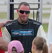 Johnny Sauter interacting with fans at Wisconsin International Raceway 2014.jpg
