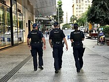 Queensland Police Service officers patrolling in Brisbane Police officers of Queensland Police Service, on the beat, in Brisbane Australia.jpg