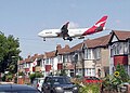 Image 1Qantas Boeing 747-400 about to land at Heathrow Airport, seen beyond the roofs of Myrtle Avenue, Hounslow.