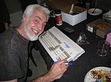 RJ Mical signing an Amiga 1200 for the 25th anniversary of the Amiga computer, 2011
