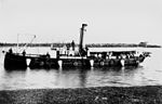 Submarine minefield service vessel "Miner" with conical mines and connecting cables hanging over side [gallery 8]