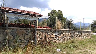 Trilingual sign hailing entrance on road to both the villages of Krani and Arvati, in Krani