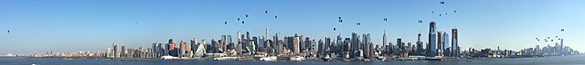 A panorama of Manhattan, the world's largest central business district, February 2018.1. Riverside Church •  2. Time Warner Center •  3. 220 Central Park South •  4. Central Park Tower •  5. One57 •  6. 432 Park Avenue •  7. 53W53 •  8. Chrysler Building •  9. Bank of America Tower •  10. Conde Nast Building •  11 The New York Times Building •  12 Empire State Building •  13. Manhattan West •  14a: 55 Hudson Yards, b: 35 Hudson Yards, c: 10 Hudson Yards, d: 15 Hudson Yards) •  15. 56 Leonard Street •  16. 8 Spruce Street •  17. Woolworth Building •  18. 70 Pine Street •  19. 30 Park Place •  20. 40 Wall Street •  21. Three World Trade Center •  22. Four World Trade Center •  23. One World Trade Center