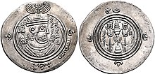 The obverse of a silver-colored coin inscribed in Middle Persian with the name of a sovereign Muslim ruler and Muslim religious formulas on either side of a figural depiction of an ancient Iranian ruler