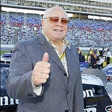 Ollen Bruton Smith at Texas Motor Speedway in 2005, displaying a thumbs-up gesture