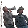 President George W. Bush speaking at Ground Zero with Bob Beckwith beside him