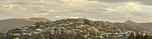 Huntsbury viewed from neighbouring St Martins. Also shown are the landmarks of Mt Vernon on the left and Te Heru o Kahukura / Sugarloaf and its transmitter on the right.