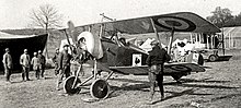Jules Vedrines in his Nieuport 16, armed with a Lewis, after clearing the front line of German observation balloons with the first rocket attack in history Jules Vedrines in a Nieuport 16 fighter at Vadelaincourt airfield (cropped).jpg