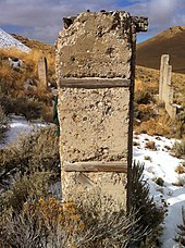 Ruins of an early 20th-century mill, Winnemucca Mountain Mill Remnants, Winnemucca Mountain.jpg