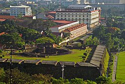 An aerial photo showing the walls and a university located within Intramuros