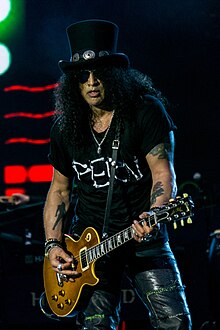 Slash playing guitar onstage