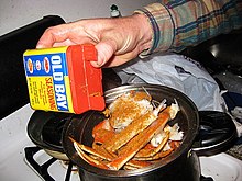 Putting Old Bay on crab legs Snow crab legs and old bay seasoning.jpg