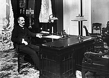 K. J. Stahlberg (1865-1952), the first President of the Republic of Finland, defined Finland's anchoring as a country defending liberal democracy. Stahlberg at his office in 1919. Stahlberg-in-office1919.jpg