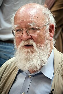 Dennett wearing a button-up shirt and a jacket