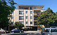 Mid-20th century apartments with soft story parking. Zoning at the time allowed 4 stories plus a small penthouse.