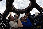 Kru ISS-27 Dmitri Kondratyev dan Paolo Nespoli memotret bumi melalui Cupola