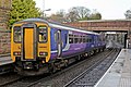 A Northern Rail Class 156 waits at the station.