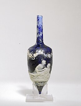Cameo glass perfume bottle, found in the Roman necropolis of Ostippo, Spain (25 BCE-14 CE), showing two males on a bed; the other side, not shown, has a female and a male (George Ortiz Collection) Roman-era perfume bottle made of cameo glass showing homoerotic scene.jpg