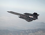 SR-71A flown by NASA’s Ames-Dryden Flight Research Facility (later, Dryden Flight Research Center), Edwards, California, cruises over the Tehachapi Mountains during a September 1992 flight.