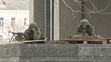 Masked men at the building of the Verkhovna Rada of Crimea during its attack, 27 February 2014 VOA-armed men 01-03-14.jpg