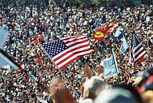 Crowds at the inaugural running of the United States Grand Prix at Indianapolis exceeded 200,000 Flag crowd.jpg