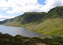 Head of Loch Turret. Looking down on the end of the reservoir. There is a lot of hummocky land here, these hills were often thought of as fairy dwellings, but are piles of stones and gravel left by streams flowing off melting glaciers.