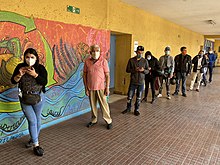 Long queues were registered in the 2020 Chilean national plebiscite due to a record turnout and to avoid agglomerations. Plebiscito Nacional 2020 La Cisterna 03.jpg