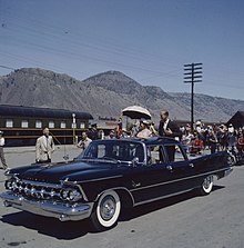 Elizabeth II and Prince Philip riding in a convertible through Kamloops during the 1959 tour Queen Elizabeth and Prince Philip in Canada, 1959.jpg