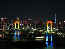 Rainbow colored Rainbow Bridge at night.jpg