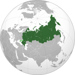 Russia on the globe in dark green, with the disputed Kuril Islands and annexed Crimea in green and Russian-annexed territories of Ukraine shown in light green.[a]