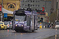 GC Comeng Z-Class tram in advertising livery operated by Yarra Trams at [[w:Bourke Street, on Princes Bridge, Melbourne.