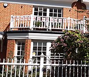 "small window panes, ... bay windows, wooden balconies"[4]