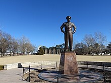 Dwight D. Eisenhower statue in "Champion of Peace" circle in Abilene, Kansas Eisenhower Statue Abilene Kansas.jpg