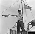 French Navy sailor wearing classic marinière shirt which inspire Coco Chanel of the stripe design