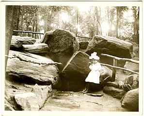 Unidentified girl drinking at Montaigne's Spring, McGown's Pass, Central Park, New York City, July 23, 1898